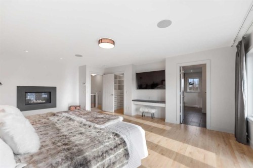 226 Mahogany Bay Se, Calgary, AB - Indoor Photo Showing Bedroom With Fireplace
