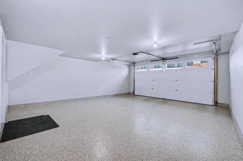 254-7820 Spring Willow Drive Sw, Calgary, AB - Indoor Photo Showing Garage