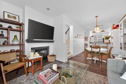 235 Ascot Circle Sw, Calgary, AB - Indoor Photo Showing Living Room With Fireplace
