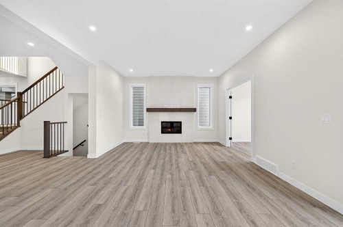 29 Rowmont Common Nw, Calgary, AB - Indoor With Fireplace