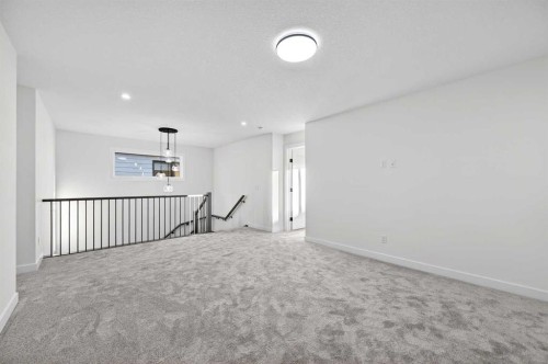 29 Rowmont Common Nw, Calgary, AB - Indoor Photo Showing Other Room