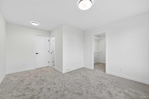 29 Rowmont Common Nw, Calgary, AB - Indoor Photo Showing Other Room