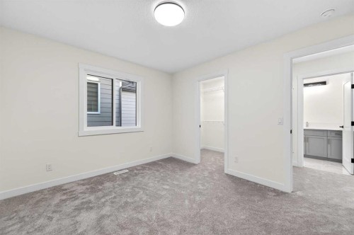 29 Rowmont Common Nw, Calgary, AB - Indoor Photo Showing Other Room