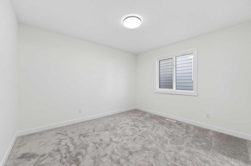 29 Rowmont Common Nw, Calgary, AB - Indoor Photo Showing Other Room