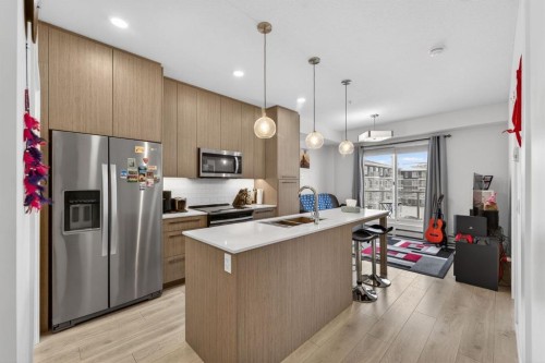 2311-76 Cornerstone Passage Ne, Calgary, AB - Indoor Photo Showing Kitchen With Stainless Steel Kitchen With Double Sink With Upgraded Kitchen