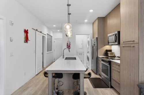2311-76 Cornerstone Passage Ne, Calgary, AB - Indoor Photo Showing Kitchen With Double Sink With Upgraded Kitchen