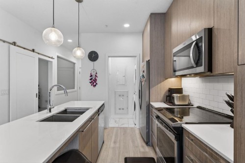 2311-76 Cornerstone Passage Ne, Calgary, AB - Indoor Photo Showing Kitchen With Double Sink With Upgraded Kitchen