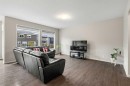 175 Howse Rise Ne, Calgary, AB  - Indoor Photo Showing Living Room 