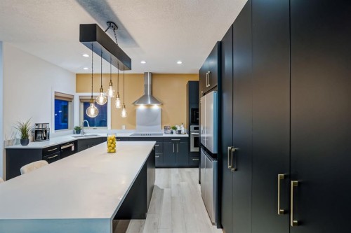 203 Sunset Circle, Cochrane, AB - Indoor Photo Showing Kitchen With Upgraded Kitchen