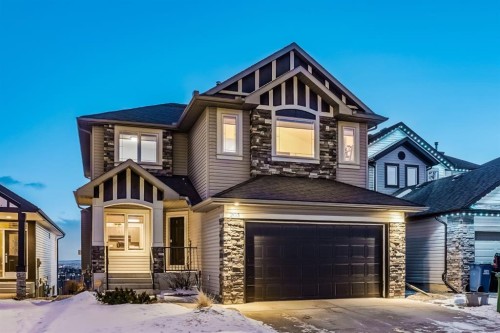 203 Sunset Circle, Cochrane, AB - Outdoor With Facade