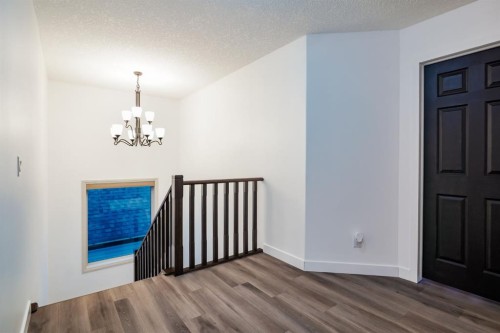 203 Sunset Circle, Cochrane, AB - Indoor Photo Showing Other Room