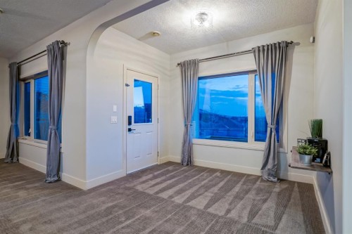 203 Sunset Circle, Cochrane, AB - Indoor Photo Showing Other Room