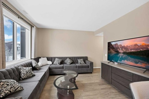 203-350 Redstone Ne, Calgary, AB - Indoor Photo Showing Living Room