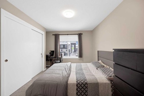 203-350 Redstone Ne, Calgary, AB - Indoor Photo Showing Bedroom