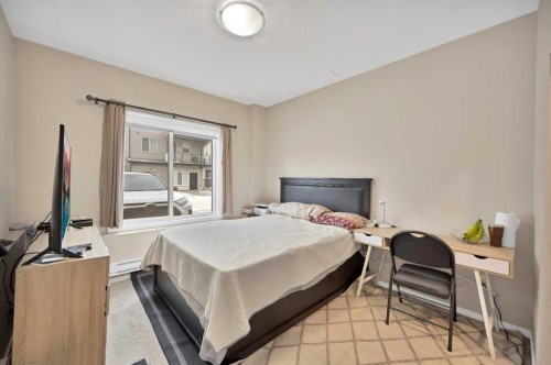 203-350 Redstone Ne, Calgary, AB - Indoor Photo Showing Bedroom
