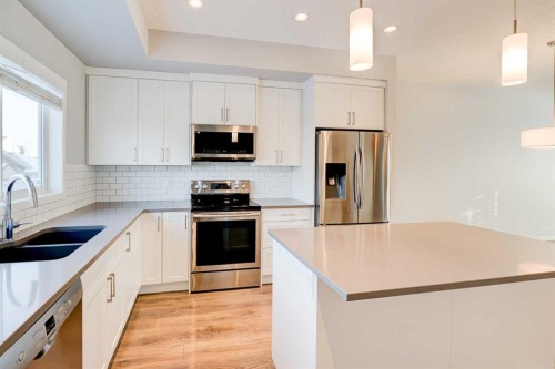 8036 Masters Boulevard, Calgary, AB - Indoor Photo Showing Kitchen With Stainless Steel Kitchen With Double Sink With Upgraded Kitchen