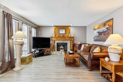 16 Bedwood Rise Ne, Calgary, AB - Indoor Photo Showing Living Room With Fireplace
