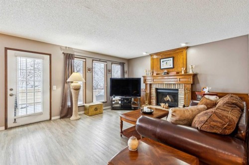 16 Bedwood Rise Ne, Calgary, AB - Indoor Photo Showing Living Room With Fireplace
