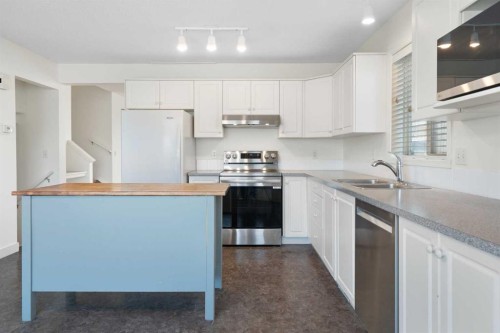 154 Arbour Crest Circle Nw, Calgary, AB - Indoor Photo Showing Kitchen With Double Sink