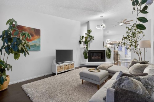 643 Strathcona Drive Sw, Calgary, AB - Indoor Photo Showing Other Room With Fireplace