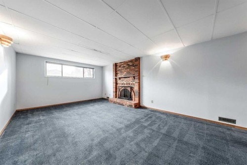 24 Templeson Road Ne, Calgary, AB - Indoor With Fireplace