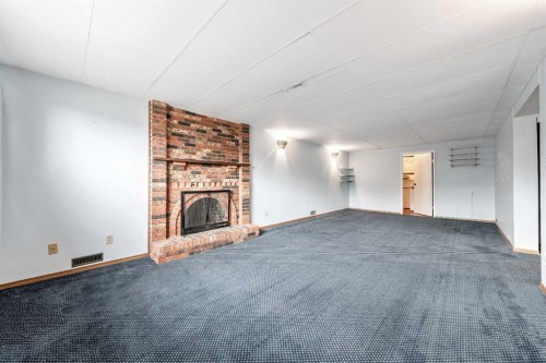 24 Templeson Road Ne, Calgary, AB - Indoor With Fireplace