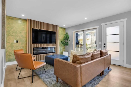122 Hawkstone Drive Nw, Calgary, AB - Indoor Photo Showing Living Room With Fireplace