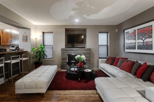 48 Sage Valley Drive Nw, Calgary, AB - Indoor Photo Showing Living Room With Fireplace