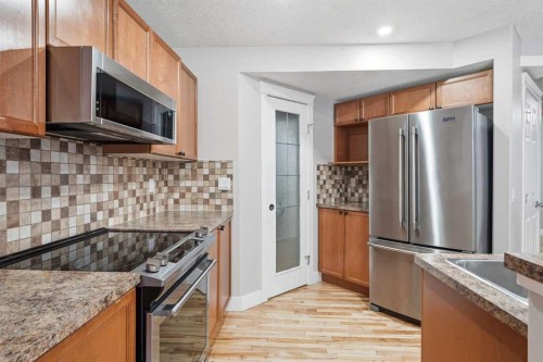 32 Evanscove Heights Nw, Calgary, AB - Indoor Photo Showing Kitchen With Upgraded Kitchen