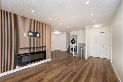 140 Whitworth Way, Calgary, AB - Indoor Photo Showing Other Room With Fireplace