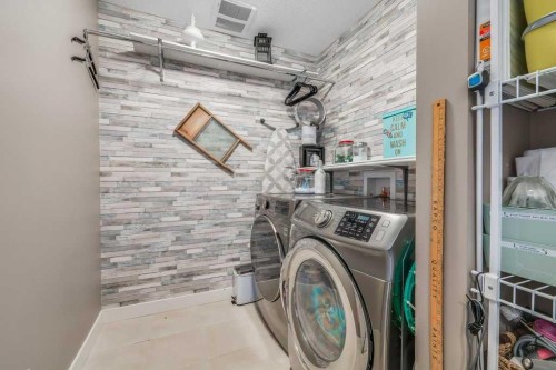 140 Cranford Walk Se, Calgary, AB - Indoor Photo Showing Laundry Room