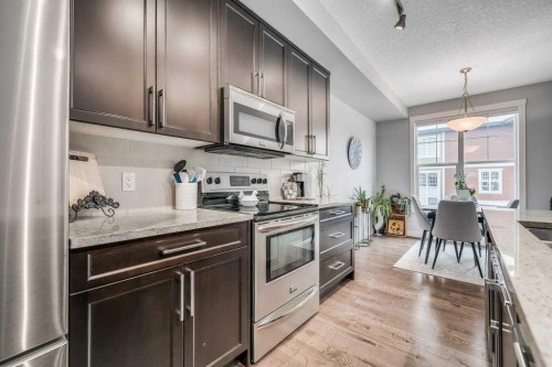140 Cranford Walk Se, Calgary, AB - Indoor Photo Showing Kitchen With Stainless Steel Kitchen With Upgraded Kitchen