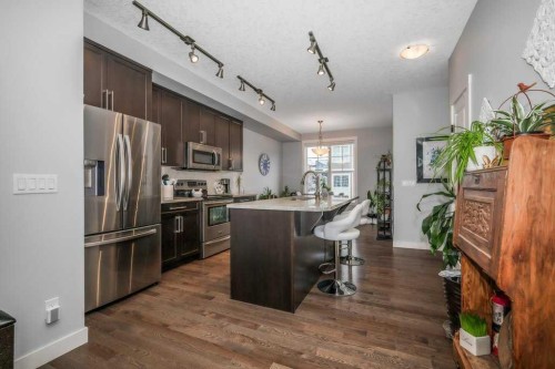 140 Cranford Walk Se, Calgary, AB - Indoor Photo Showing Kitchen With Stainless Steel Kitchen With Upgraded Kitchen