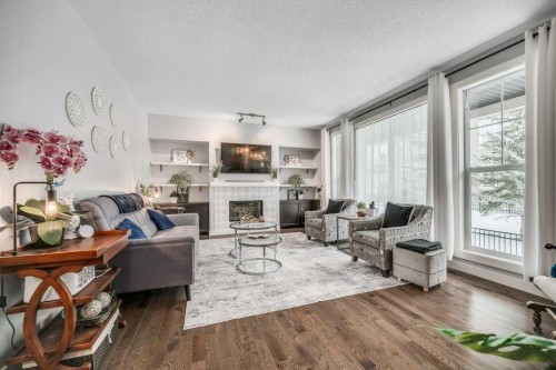 140 Cranford Walk Se, Calgary, AB - Indoor Photo Showing Living Room With Fireplace