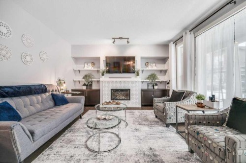 140 Cranford Walk Se, Calgary, AB - Indoor Photo Showing Living Room With Fireplace