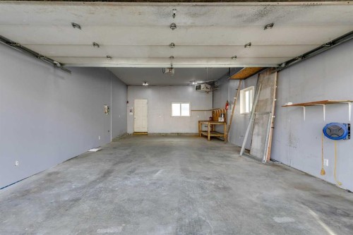 228 Luxstone Place Sw, Airdrie, AB - Indoor Photo Showing Garage