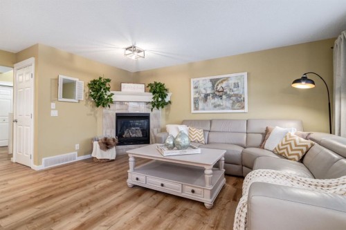 82 Cranwell Common Se, Calgary, AB - Indoor Photo Showing Living Room With Fireplace