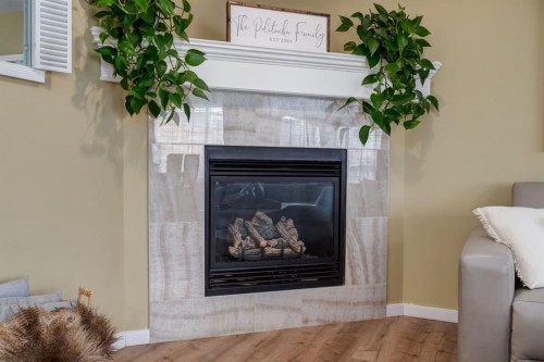 82 Cranwell Common Se, Calgary, AB - Indoor Photo Showing Living Room With Fireplace