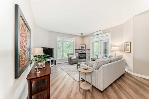 7204-14 Hemlock Crescent Sw, Calgary, AB - Indoor Photo Showing Living Room With Fireplace