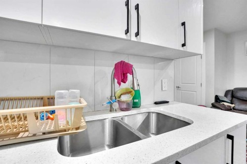 14 Belvedere Common Se, Calgary, AB - Indoor Photo Showing Kitchen With Double Sink