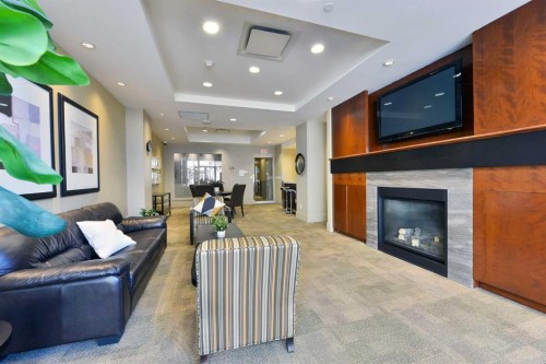 2404-1118 12 Avenue Sw, Calgary, AB - Indoor Photo Showing Living Room With Fireplace