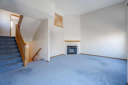 203 Anderson Grove Sw, Calgary, AB - Indoor Photo Showing Other Room With Fireplace