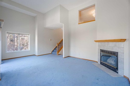 203 Anderson Grove Sw, Calgary, AB - Indoor With Fireplace