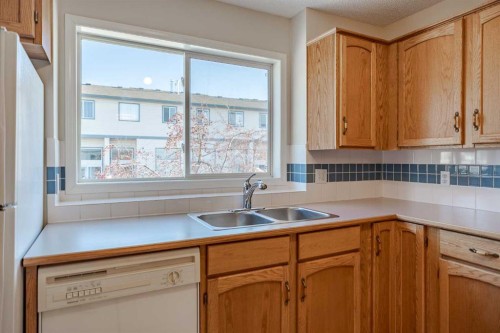 203 Anderson Grove Sw, Calgary, AB - Indoor Photo Showing Kitchen With Double Sink