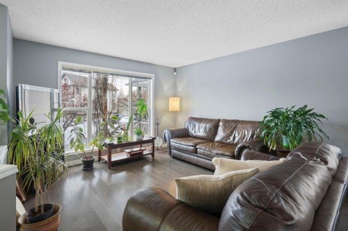176 Prestwick Heights Se, Calgary, AB - Indoor Photo Showing Living Room