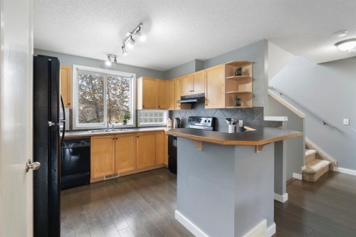 176 Prestwick Heights Se, Calgary, AB - Indoor Photo Showing Kitchen With Double Sink