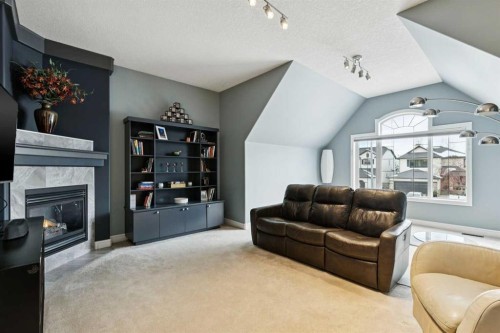 810 Wentworth Place Sw, Calgary, AB - Indoor Photo Showing Living Room With Fireplace
