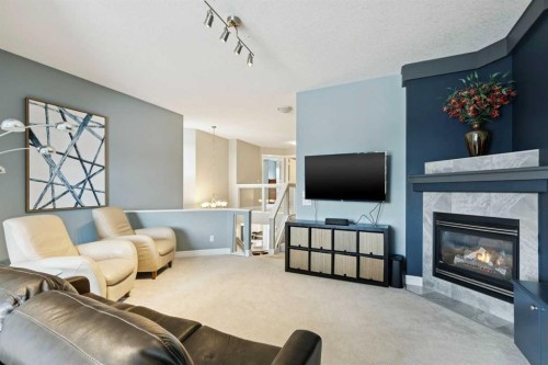 810 Wentworth Place Sw, Calgary, AB - Indoor Photo Showing Living Room With Fireplace