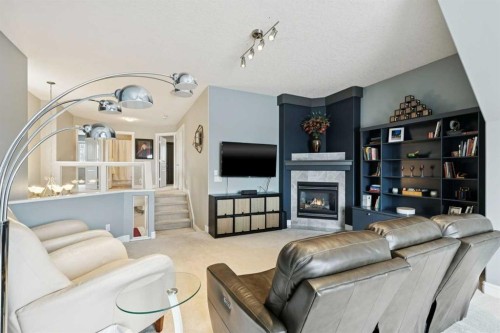 810 Wentworth Place Sw, Calgary, AB - Indoor With Fireplace