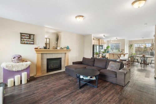 284 Copperfield Heights Se, Calgary, AB - Indoor Photo Showing Living Room With Fireplace